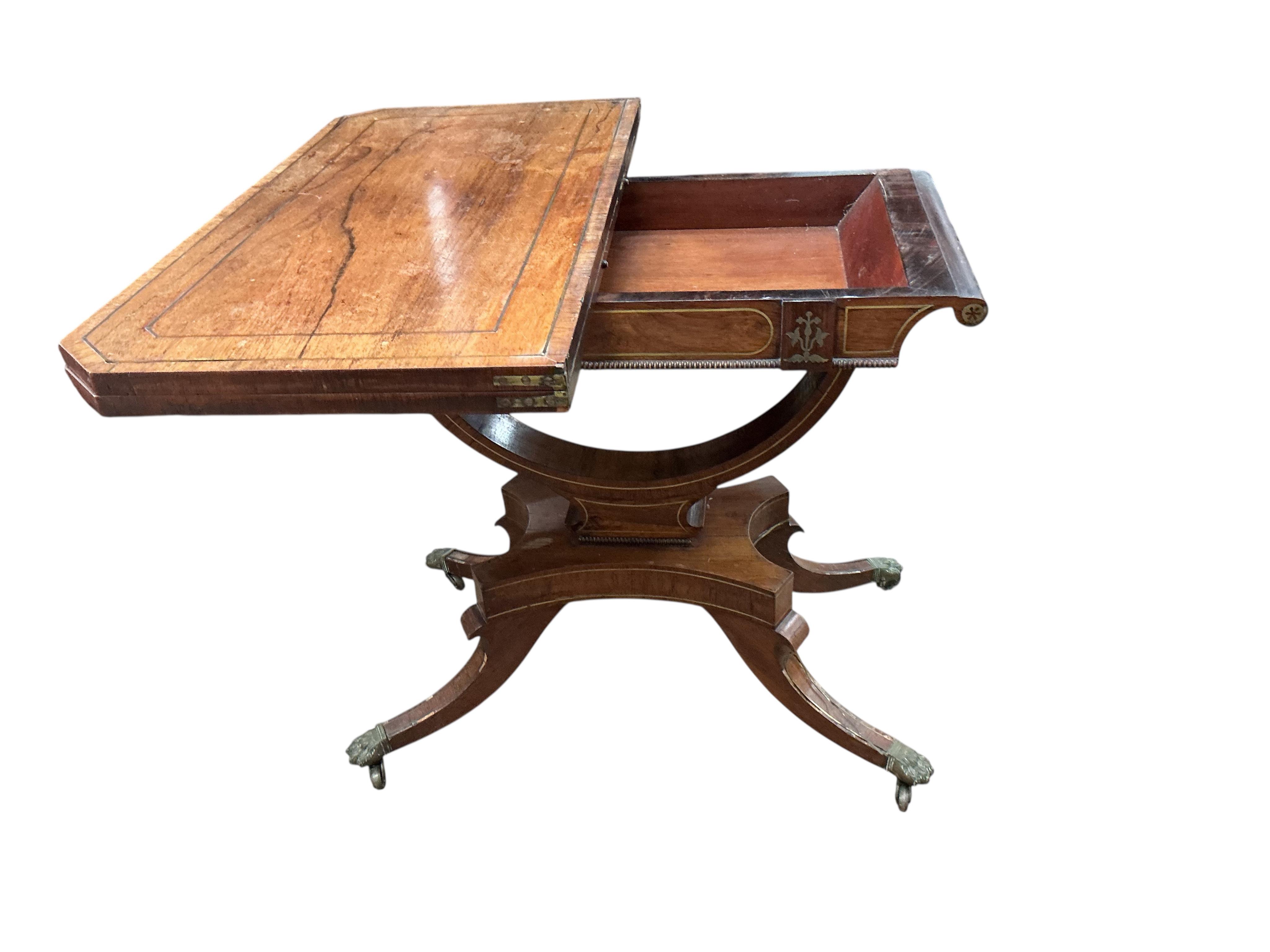 A Regency brass mounted rosewood folding card table, width 89cm, depth 44cm, height 74cm